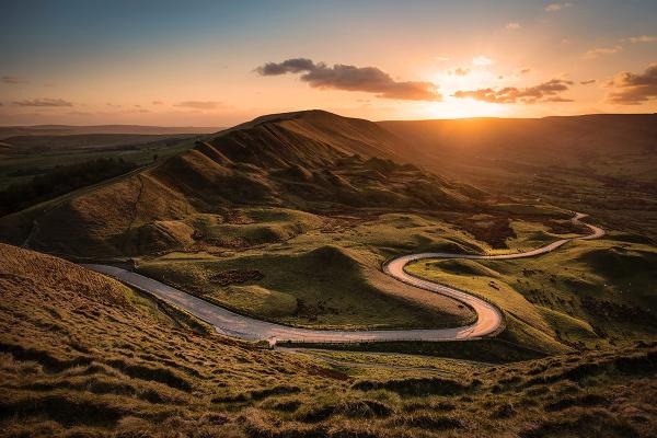 Sunset over mountains and road